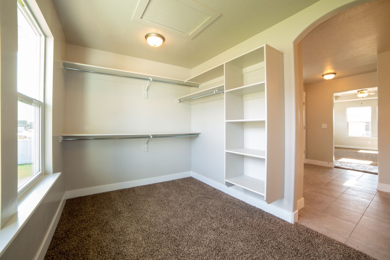 Custom walk-in closet renovation with built-in shelving