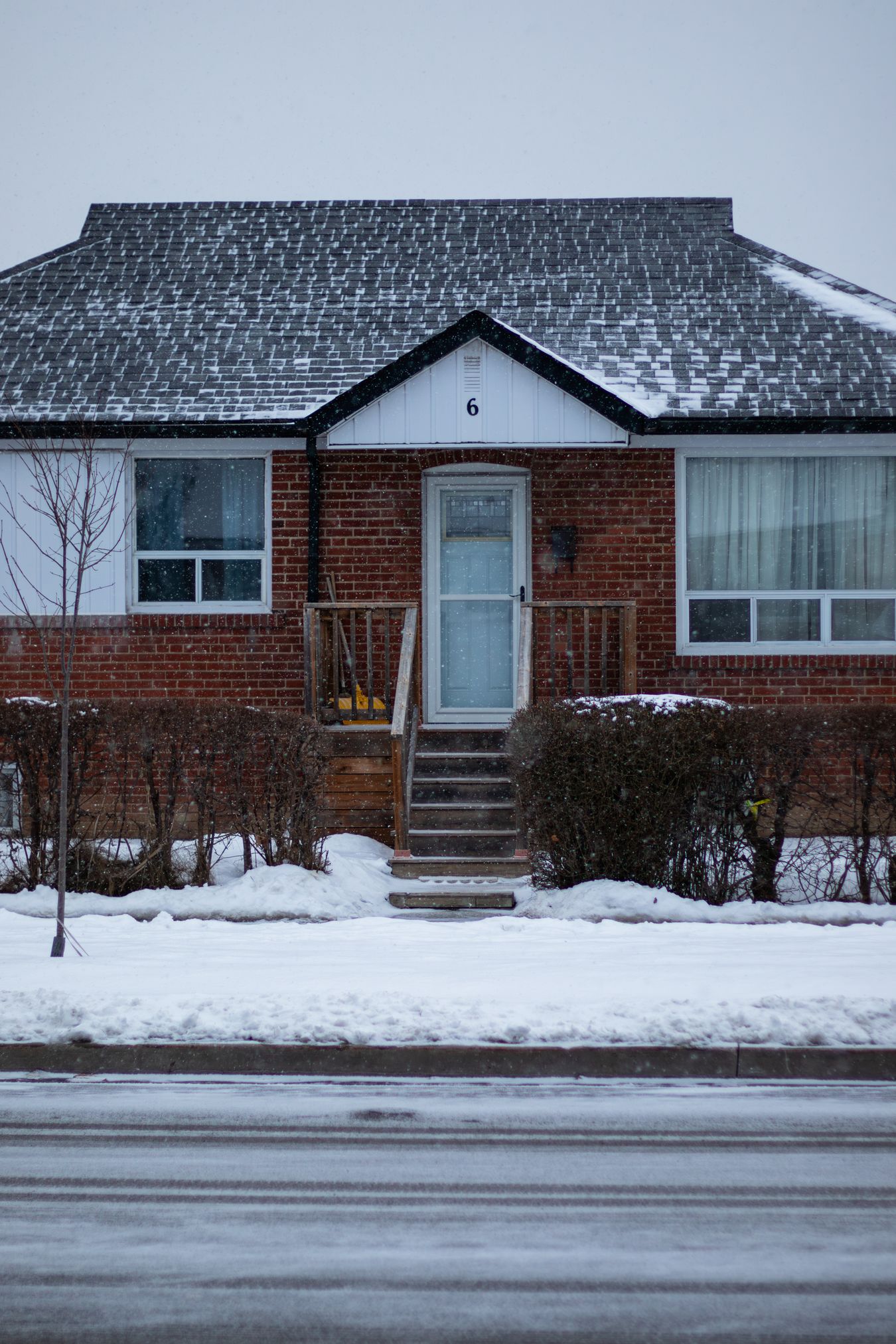 Snow-covered GTA home exterior in winter