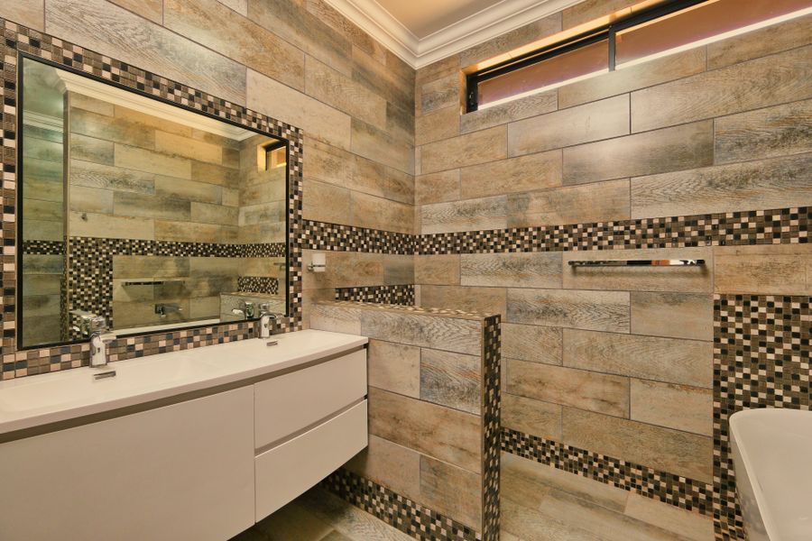 Elegant renovated bathroom by Reno Rise