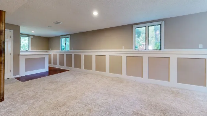 Basement room with windows and natural light