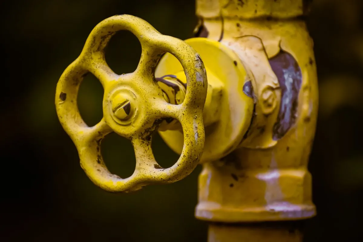 Yellow shut-off valve on a water pipe